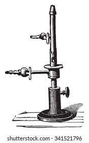 Debray torch for spectral analysis, vintage engraved illustration. Industrial encyclopedia E.-O. Lami - 1875.
