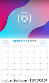 December 2019. Calendar planner stationery design template with place for photo. Week starts on Sunday. Vector illustration