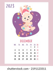 December 2023 calendar. Cute bunny in santa hat with garland and christmas balls. Vector illustration. Vertical Template. Week from Monday In English. rabbit is symbol 2023 year to Chinese zodiac.