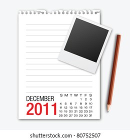 December month calendar note paper with pencil