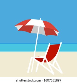 Deck chair and umbrella on the background of the sea and white sand on the beach.