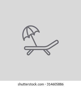 a deckchair with an umbrella vector icon