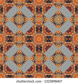 For decor, fabric, textile, cloth. Simple abstract background in orange, gray and blue colors. Ornamental texture with linear shapes, zigzag lines, lace pattern. Vector geometric seamless pattern.