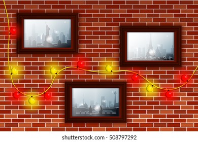 Decorated brick wall with Christmas lights and photos. Winter and snowfall in different cities illustrated in the photos. Pictures in brown frames.