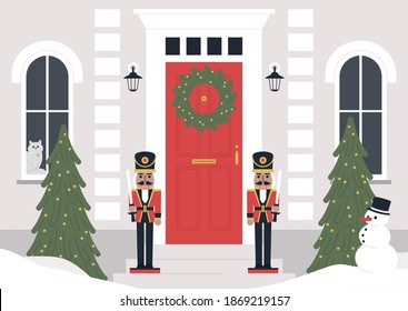 A decorated building entrance, a Christmas wreath on the door, a Xmas tree, nutcracker statues,  a winter holiday concept