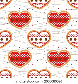 Decorated Christmas gingerbread cookies in the shape of a heart seamless pattern. Background with glazed hearts, dots and thread. Template for festive packaging, fabric, wallpaper and New Year's decor