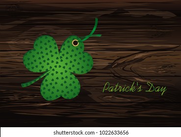 Decorated with a clover pattern tied with green ribbon. St.Patrick 's Day. Vector illustration. Greeting card with empty space for text or advertising. On a wooden background.
