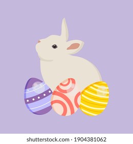 Decorated colorful Easter eggs with a cute white bunny.  