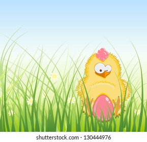 Decorated Easter Egg and Chicken in the Grass