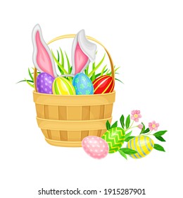 Decorated Easter Eggs or Paschal Eggs Rested in Wicker Basket with Green Grass and Spring Flowers Vector Illustration