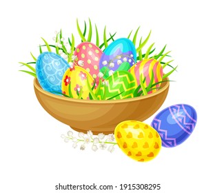 Decorated Easter Eggs or Paschal Eggs Rested in Wooden Bowl with Green Grass with Spring Flowers Vector Arrangement