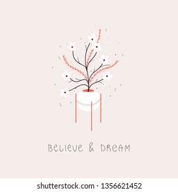 Decorated flower pot with colorful plants and the "believe and dream" phrase.