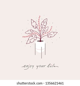 Decorated flower pot with colorful plants and the "enjoy your life" phrase.