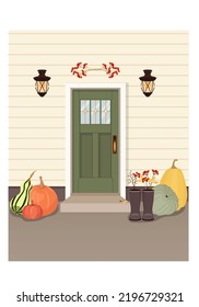 Decorated front door for Halloween with pumpkins, with red berries,with brown boots, with lanterns on the facadevector picture for postcards, prints