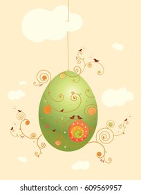 Decorated hanging egg with birds. Concept of joyful life awakening in nature in Spring.