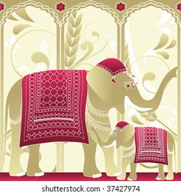 Decorated indian elephant, mother and baby in a palace.