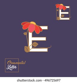 Decorated initial letter E drop cap or symbol with red flower and golden leaves