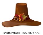 Decorated with leaves and berries, a brown wizard or pilgrim hat for Thanksgiving and Halloween holidays