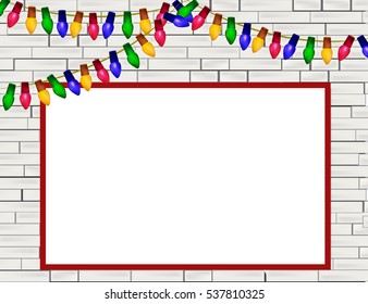 Decorated white brick wall with Christmas lights and place for text.