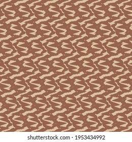 Decoración con zigzags, marcas lineales o en forma de S. Ornamento geométrico en tonos contrastantes de marrón.