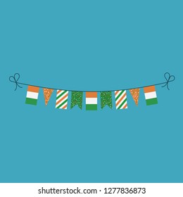 Decorations bunting flags for Ivory Coast national day holiday in flat design. Independence day or National day holiday concept.