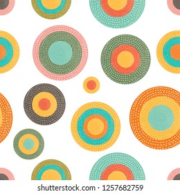 Decorative abstract polka dots in the style of the 60s.
 Cheerful polka dot vector seamless pattern. Can be used in textile industry, paper, background, scrapbooking.