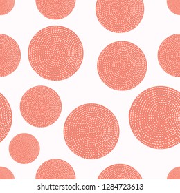 Decorative abstract polka dots in the style of the 60s. Coral color.
 Cheerful polka dot vector seamless pattern. Can be used in textile industry, paper, background, scrapbooking.