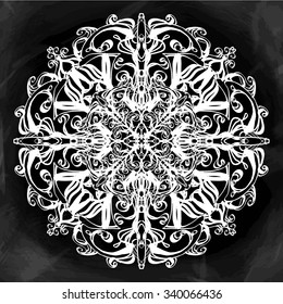 Decorative abstract snowflake on blackboard background. Geometric circle element made in vector. Hand drawn background with  copy space for your text. T-shirt print, wedding invitation,scrapbook. 