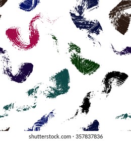 Decorative artistic seamless pattern. Texture of real strokes of black, blue, brown, green and purple mascara. Colorful brush swirls on a white background.