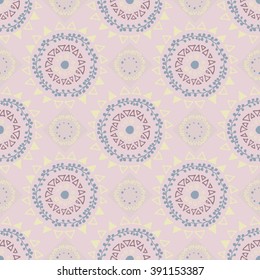 Decorative boho seamless pattern. Endless print with yellow, blue and brown round ornaments on beige background. Colorful repeating tribal artistic backdrop. For cloth design, wallpaper or wrapping