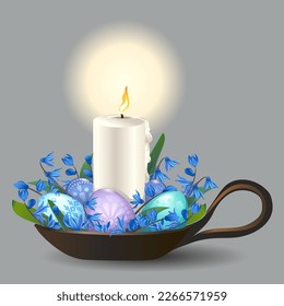 Decorative burning candle in a candlestick with blue and white flowers and Easter eggs Easter holiday element