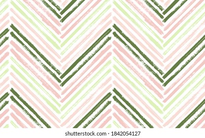 Decorative chevron interior print vector seamless pattern. Paintbrush strokes geometric stripes. Hand drawn paint texture zig zag chevron wallpaper. Watercolor fabric print seamless design.