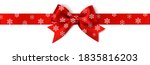 Decorative Christmas red bow with horizontal red ribbon. Vector New Year bow with snowflakes isolated on white background. Xmas decoration