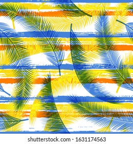 Decorative coconut palm leaves tree branches over painted stripes seamless pattern design. Hawaiian jungle foliage swimwear textile print. Geometric floral tropical leaves seamless.