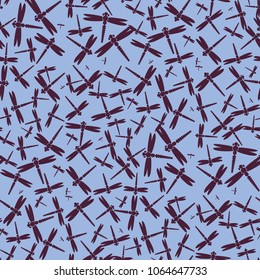 Decorative colored seamless pattern with cute dragonfly. Vintage background with many dragonflies silhouettes for your design.