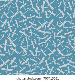 Decorative colored seamless pattern with cute dragonfly. Vintage background with many dragonflies silhouettes for your design.