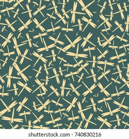 Decorative colored seamless pattern with cute dragonfly. Vintage background with many dragonflies silhouettes for your design.