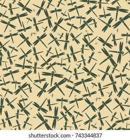 Decorative colored seamless pattern with cute dragonfly. Vintage background with many dragonflies silhouettes for your design.