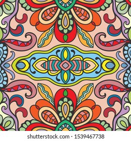 Decorative colorful seamless pattern. Fantasy doodle background with stylized flowers and leaves. Hand drawn ethnic mandala ornament for textile fabric or paper print. Design for scarf, shawl, hijab