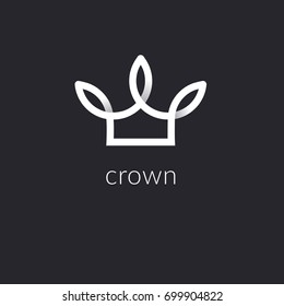 Decorative crown logo in a modern style. Exclusive emblem in the form of gradient tape on a black background. Element for beauty and spa studios.