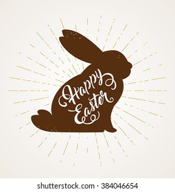 Decorative Easter card with rabbit and greeting inscription. Vector illustration.