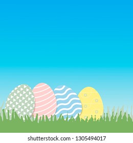 Decorative Easter eggs on green grass, with copy space - vector Illustration