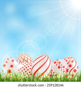 Decorative Easter eggs with red patterns in the grass and blue sky, illustration.