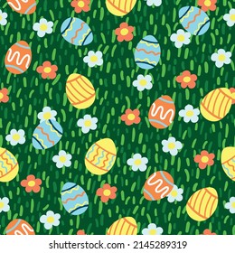Decorative easter vector pattern with easter eggs and spring flowers on meadow grass