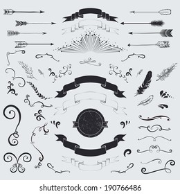 Decorative elements set: arrows, laurel, feathers, ribbons and labels.