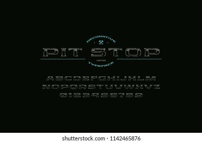 Decorative extended serif font in racing style. Letters and numbers with rough texture for logo and title design. Color print on black background