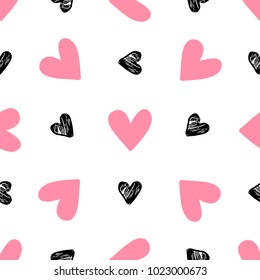 Decorative festive seamless pattern with pink and black hearts on a white background. Vector background for Valentine's day