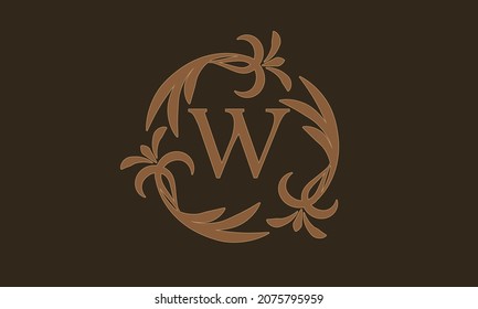 Decorative floral pattern. Luxurious elegant frame and the letter W in the center. Heraldic symbols. Exclusive calligraphic design elements identical to business sign, identity for hotel, restaurant, 