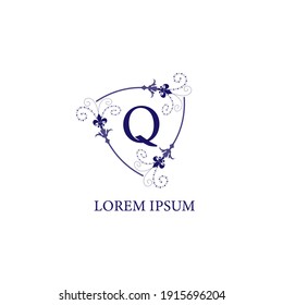 Decorative floral shield with Lily Flower ornament. Letter Q alphabet initial logo design template. Isolated on white background. Purple Violet Color Theme.