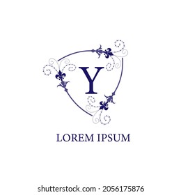 Decorative floral shield with Lily Flower ornament. Isolated on white background. Letter Y alphabet initial logo design template. Purple Violet Color Theme.